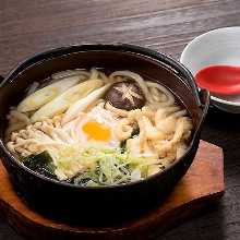 Wheat noodles boiled in a ceramic pot