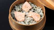 Steamed rice with toppings in wooden steamer