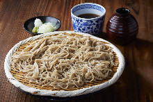 Buckwheat noodles served on a bamboo strainer