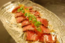 Thinly-sliced rare Wagyu beef steak with grated daikon and ponzu