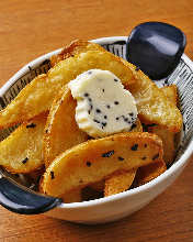 Fried unpeeled potatoes with salt kelp butter