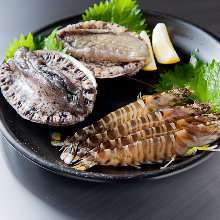 Grilled live abalone