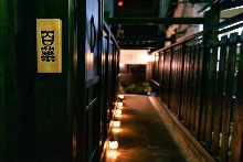 The entrance to the store is this way. Please go through the gate and proceed.