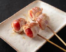 Pork wrapped tomato skewer