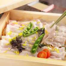 Pork steamed in a bamboo steamer