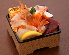 Seafood rice bowl with salmon, tuna, sea urchin, and salmon roe