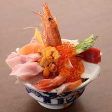 Seafood rice bowl with salmon, tuna, sea urchin, and salmon roe