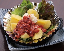 Potatoes, topped with butter or salt-fermented squid