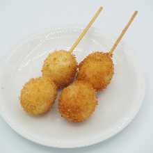 Fried quail egg skewer
