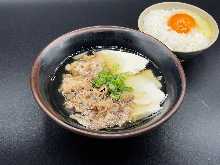 meat broth with rice with raw egg