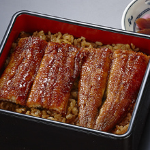 Premium eel served over rice in a lacquered box