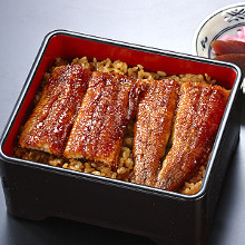 Premium eel served over rice in a lacquered box