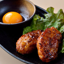 Meatballs served with egg yolk