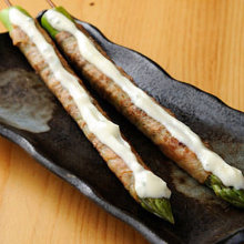 Pork wrapped asparagus skewer