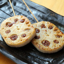 Grilled meat-stuffed lotus root skewer