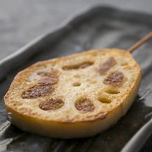 Grilled meat-stuffed lotus root skewer
