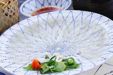 Thinly sliced pufferfish sashimi