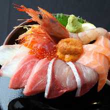 Seafood rice bowl with salmon, tuna, sea urchin, and salmon roe