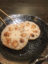 Grilled meat-stuffed lotus root skewer