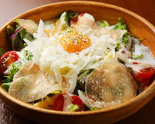 Caesar salad with soft-boiled egg and prosciutto