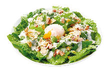 Caesar salad with soft-boiled egg and bacon