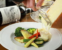 Vegetables topped with raclette cheese