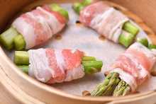 Steamed asparagus wrapped with pig meat