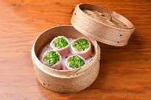 Steamed green onion wrapped with pig meat