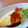 Omelet Filled with Fried Rice and Topped with Ketchup