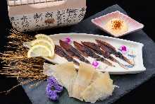 Assortment of dried fish including stingray fin and firefly squid