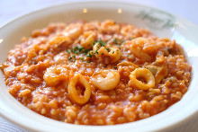 Seafood and tomato sauce risotto