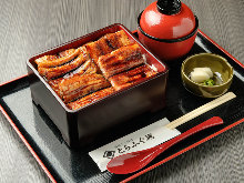 Extra premium eel served over rice in a lacquered box