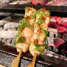 Skewered chicken tenderloin with plum and perilla