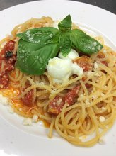 Pasta with tomato sauce, mozzarella, and basil