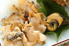 Whelk sauteed with garlic butter
