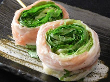 Grilled pork wrapped lettuce skewer