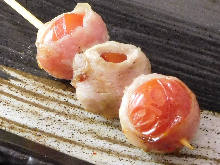 Grilled pork wrapped cherry tomato skewer