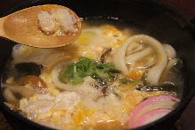 Wheat noodles boiled in a ceramic pot