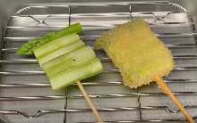 Fried asparagus skewer