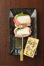 Grilled pork wrapped Japanese yam skewer