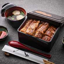 Eel served over rice in a lacquered box Taisho One and a half eel