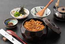 A heartwarming masterpiece, woven together by the aroma of charcoal grilling and a secret broth.