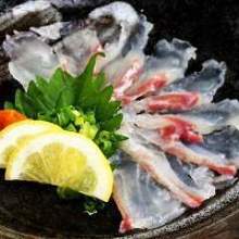 Thinly sliced sea bream sashimi