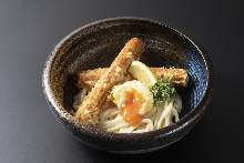 A bowl of chilled udon with soft-boiled egg