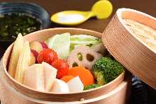 Vegetables steamed in a bamboo steamer