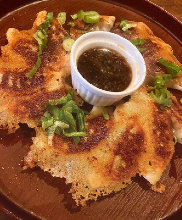 Yaki-gyoza (grilled dumplings) with Kansai dashi and kujo-negi ponzu (green onion)