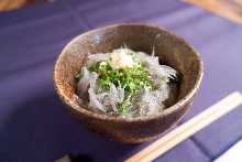 Raw whitebait on rice bowl