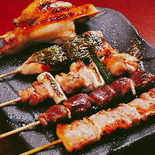 Assorted grilled chicken skewers