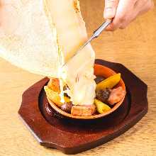 Raclette cheese with bacon and seasonal vegetables