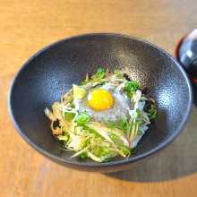 Raw whitebait on rice bowl